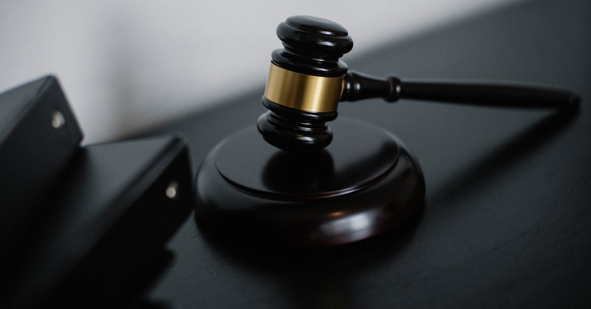 Close-up of a wooden gavel on a desk, symbolizing justice and legal authority.